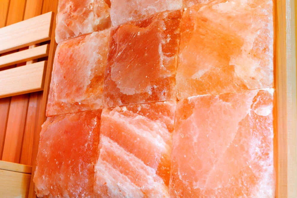 Interior dry Himalayan salt sauna wall. Sauna room at the spa hotel